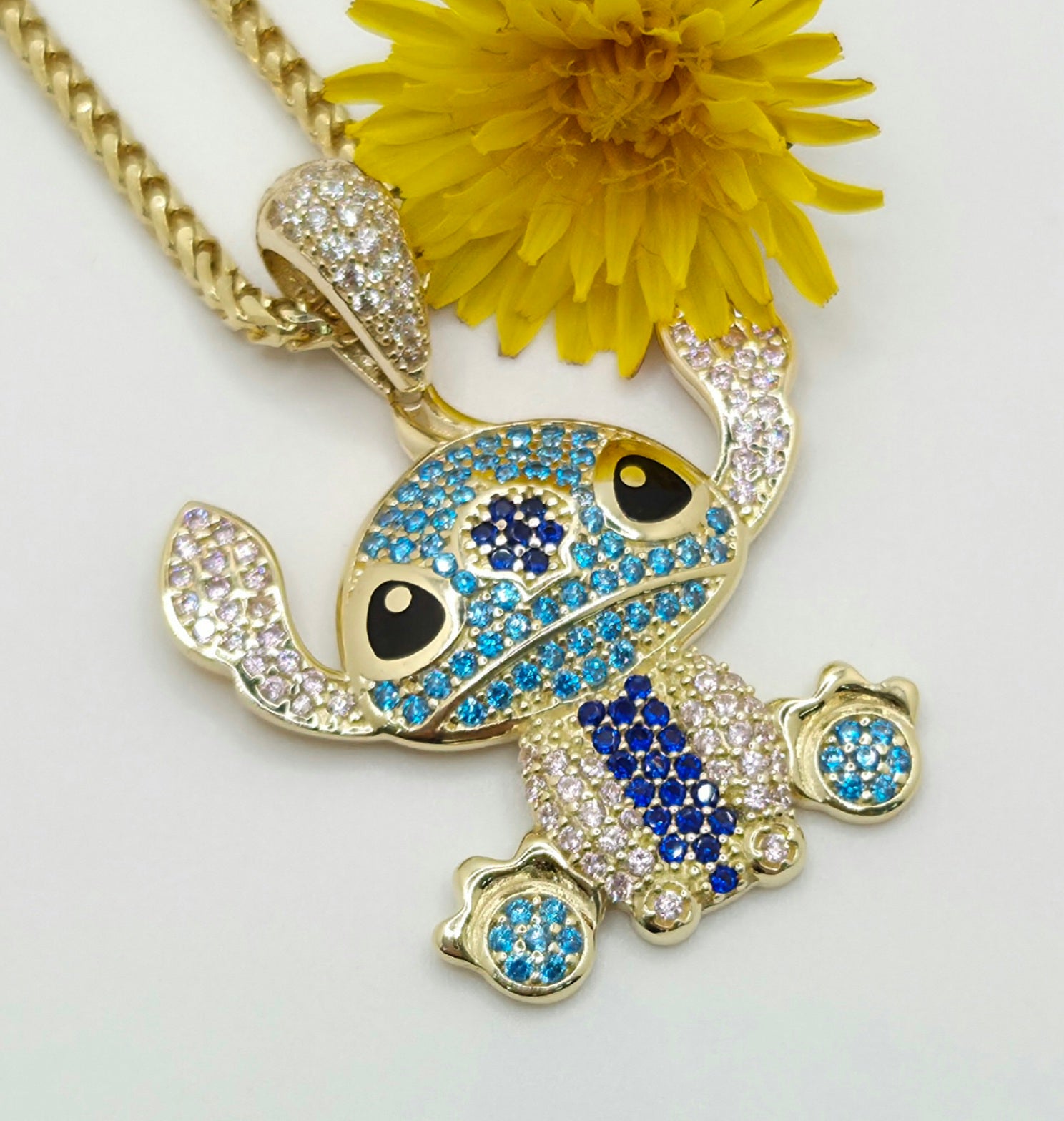 10KT BLUE CZ STITCH PENDANT Weight 4.4GR