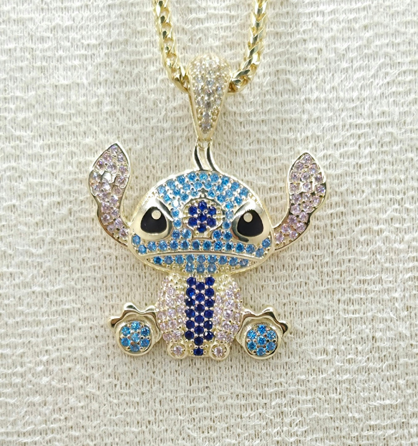 10KT BLUE CZ STITCH PENDANT Weight 4.4GR
