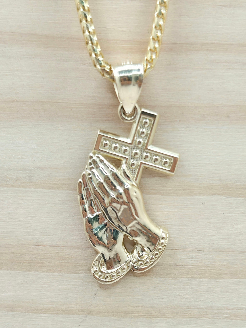 10KT MEDIUM CROSS AND HAND PENDANT Weight 2.5GR