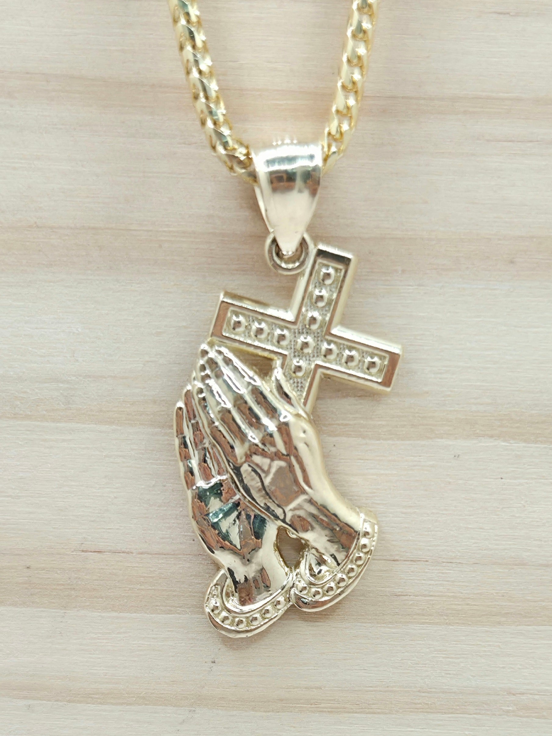 10KT MEDIUM CROSS AND HAND PENDANT Weight 2.5GR