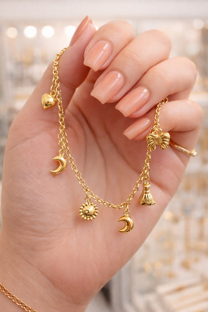 14KT MOON-SUN-MONEY BAG-HEART-RIBBON PENDANTS BRACELET Size 7INCH Weight 4.8GR