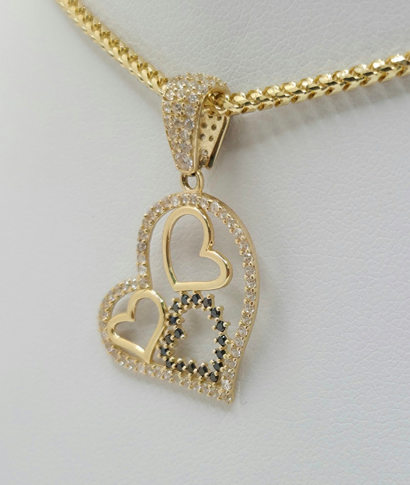 14KT CZ SILHOUETTE THREE HEARTS PENDANT  Weight 2GR