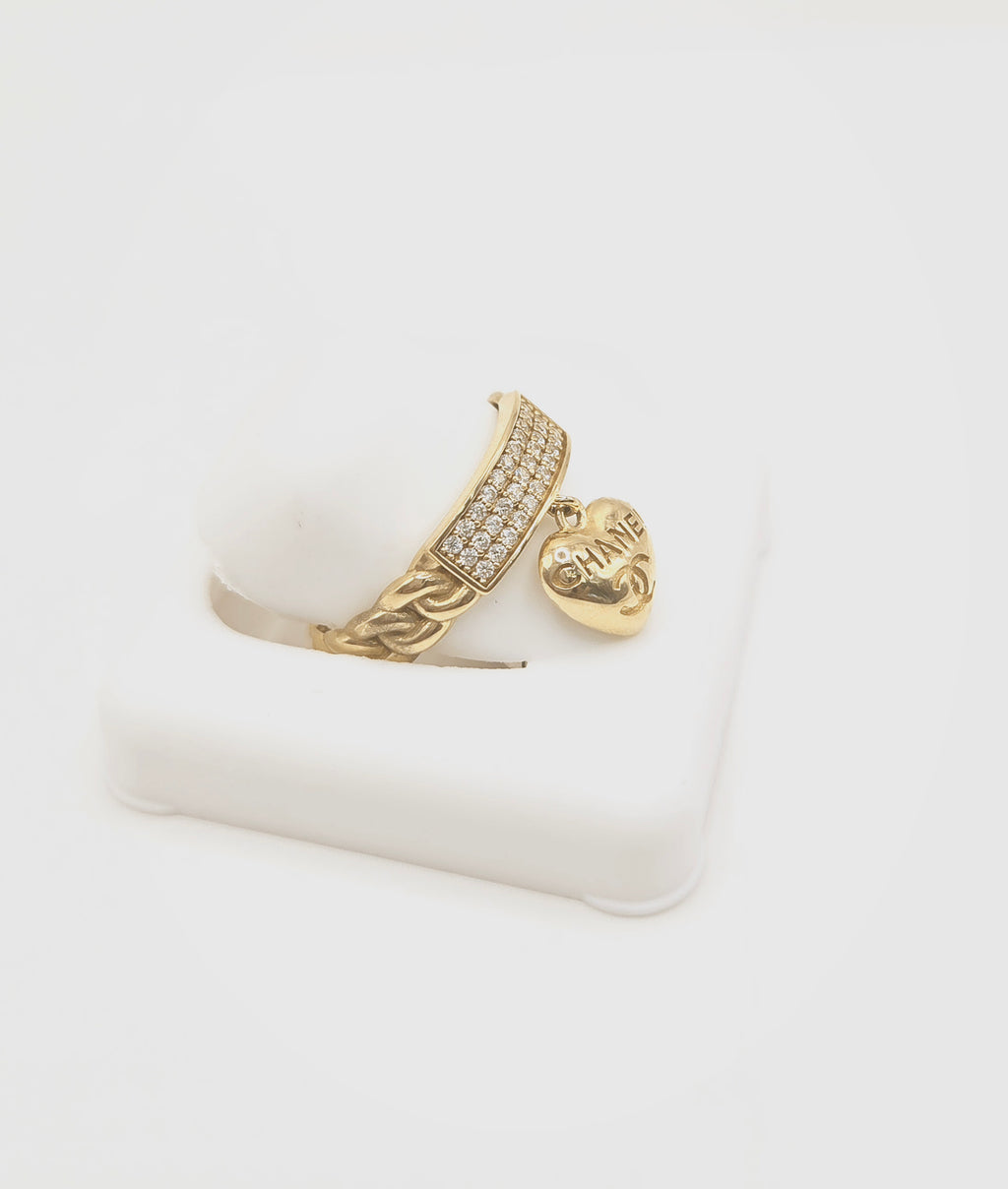 10KT EXOTIC CHAIN STYLE CZ RING WITH SMALL HEART CHARM Size 7 Weigth 2.5GR