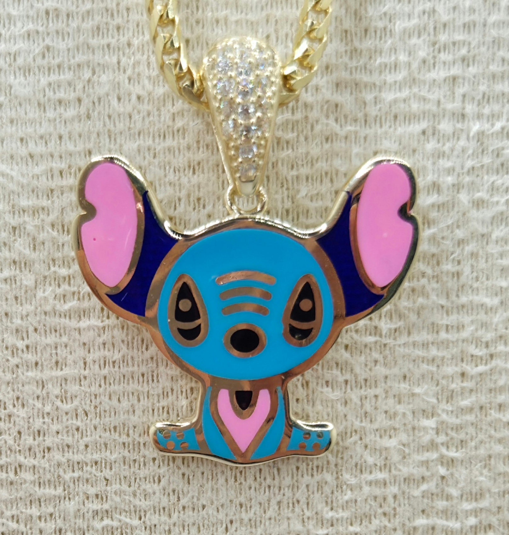 10KT SKY BLUE FLAT STYLE STITCH PENDANT Weight 3.2GR