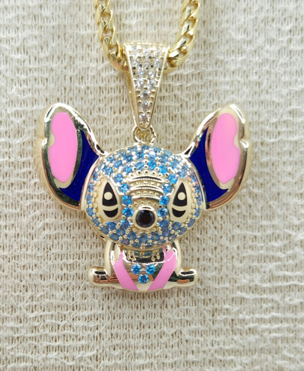 10KT CZ SKY BLUE STITCH PENDANT Weight 3.8GR