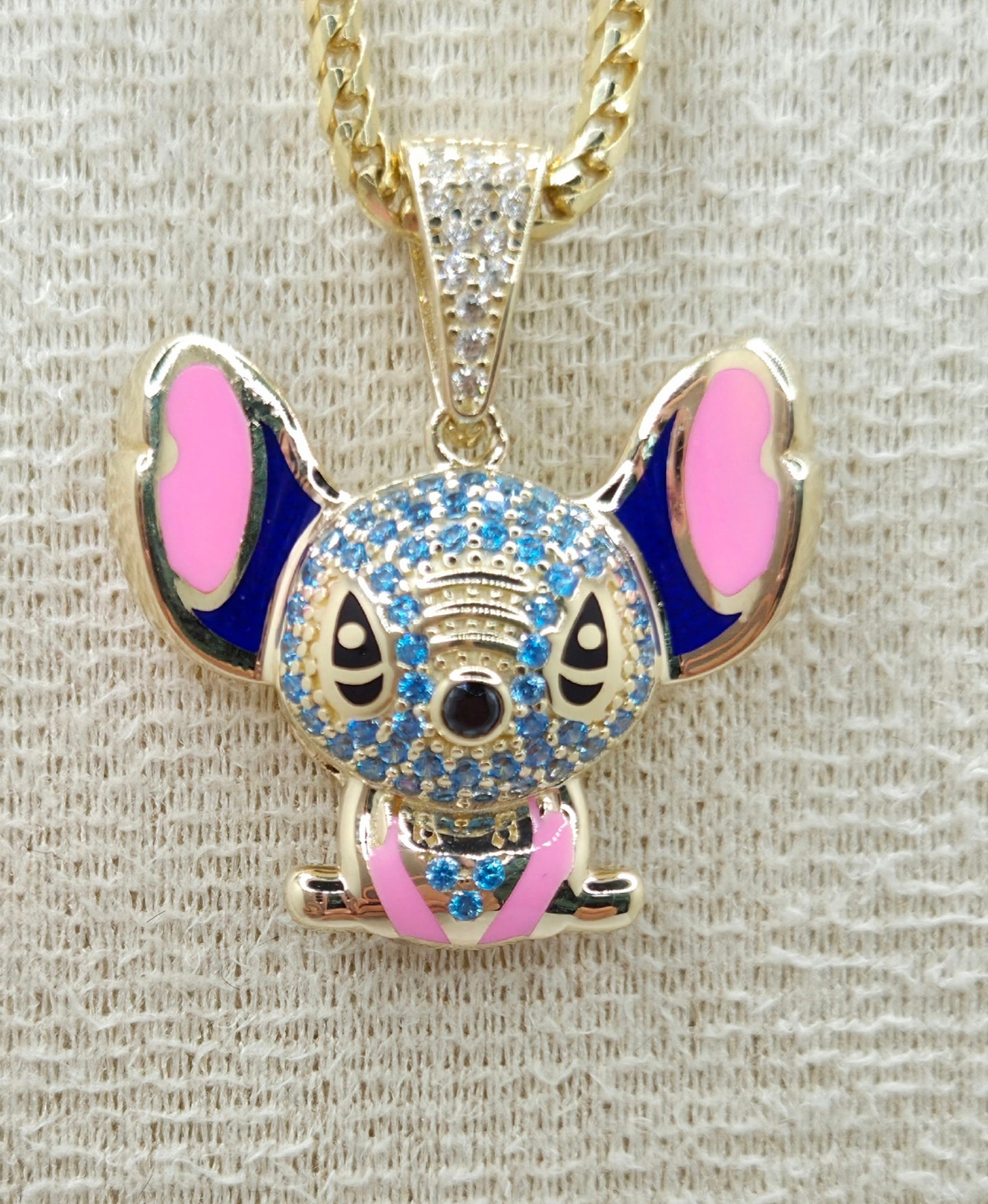 10KT CZ SKY BLUE STITCH PENDANT Weight 3.8GR