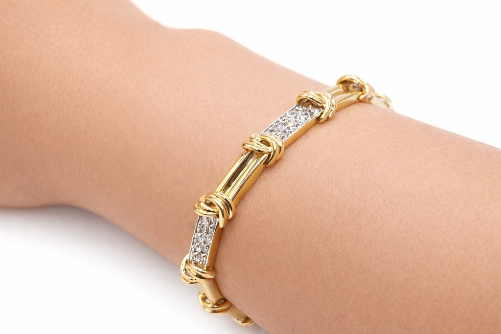 14KT ELEGANT KNOT DETAILS YELLOW GOLD AND DIAMOND WOMAN'S BRACELET Size 7INCH Weight 18.8GR