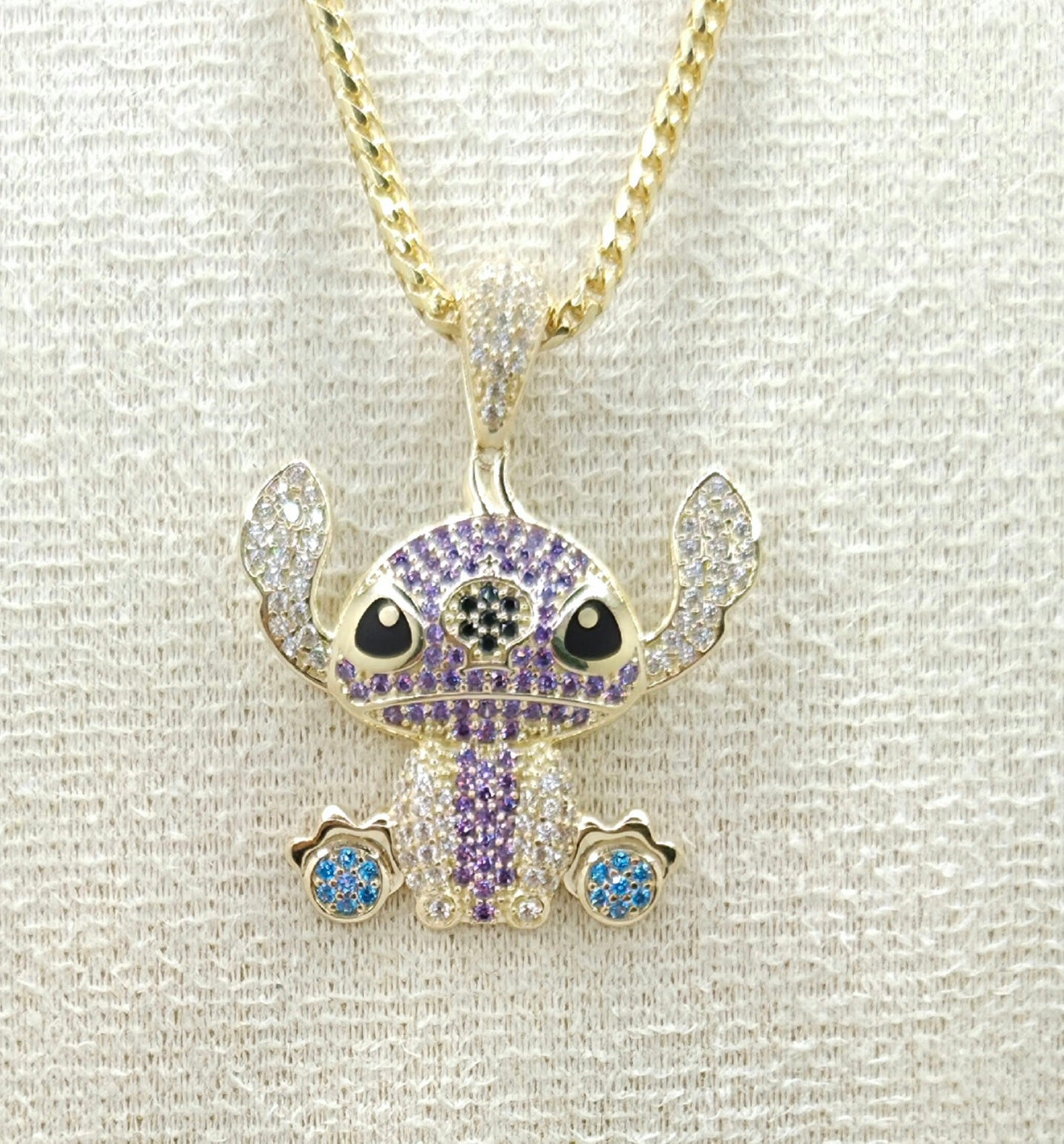 10KT PURPLE CZ STITCH PENDANT Weight 4.4GR