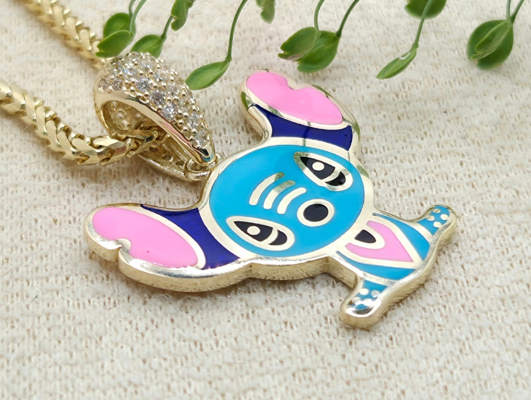 10KT SKY BLUE FLAT STYLE STITCH PENDANT Weight 3.2GR